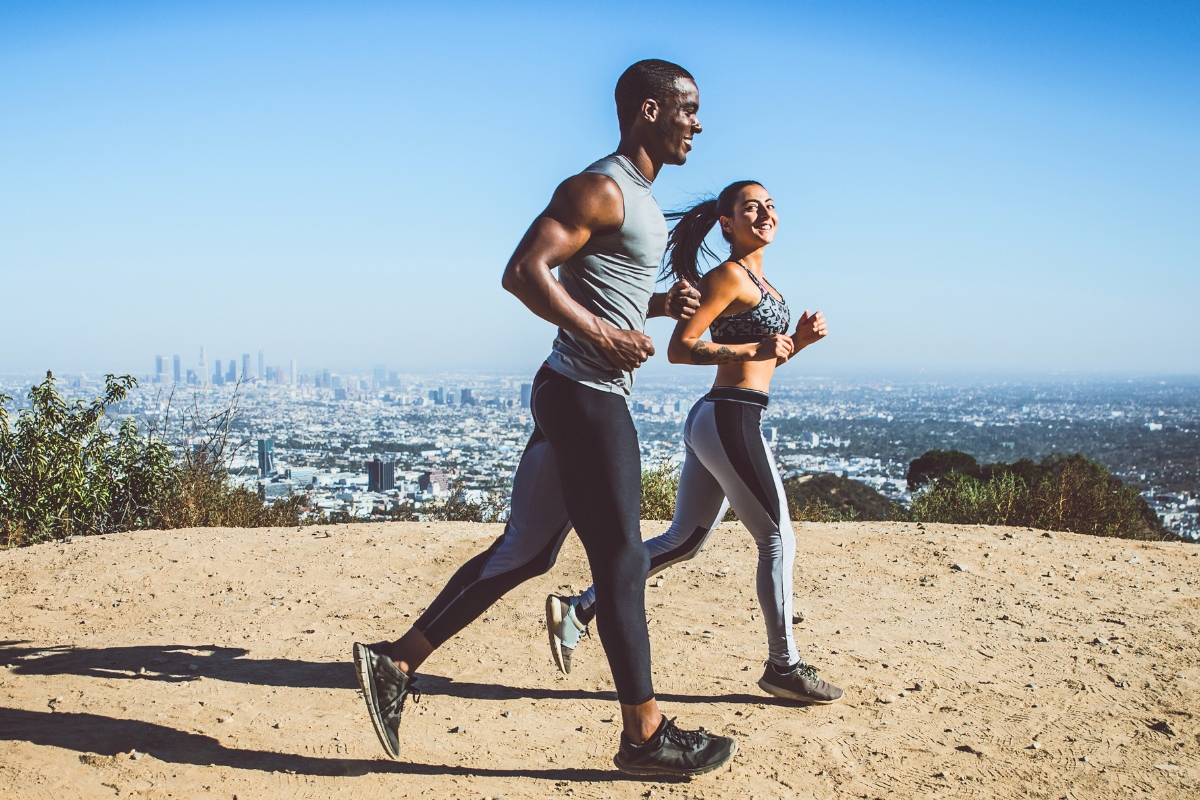 Male and female runners in the Los Angeles Hills