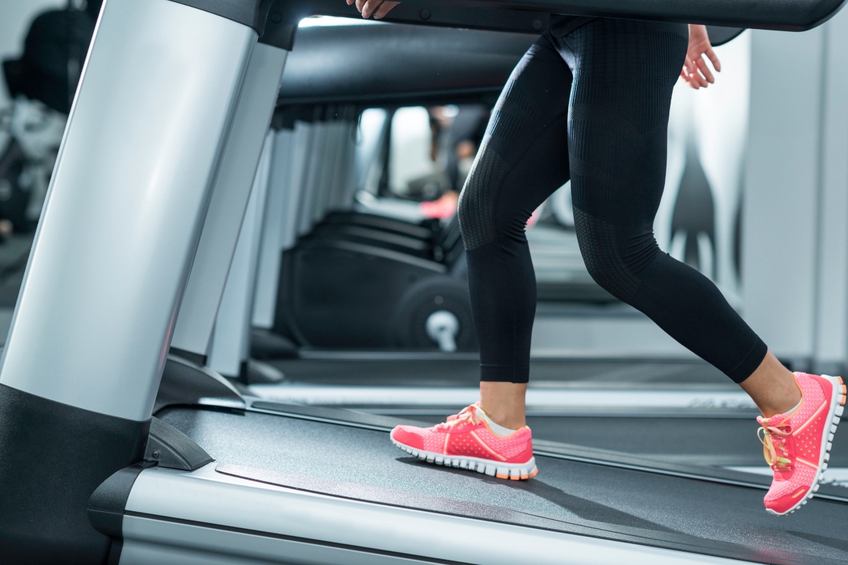 Woman running on a smart treadmill